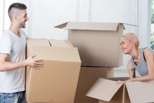 Delivery team handling household items with care